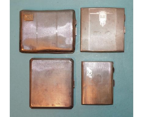 A collection of four silver engine-turned cigarette cases, various dates, all with monograms or inscriptions, total weight __