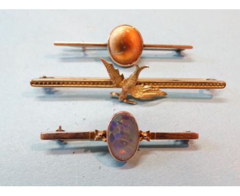 A 9ct gold bar brooch with swallow motif, another set operculum and an opal set bar brooch, total wt 10.5g, (3). 