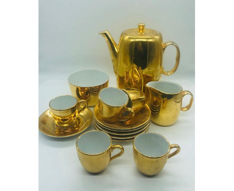 A Royal Worcester Coffee pot, sugar bowl and milk jug along with five coffee cups and six saucers