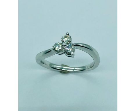 A 14ct white gold three stone ring (3.1g)