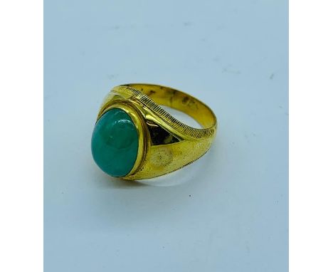 A 9ct yellow gold ring with central stone