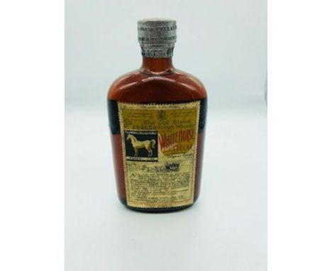 Bottle of the Old Blend Scotch Whisky of The White Horse Cellar From the Original Recipe 1746