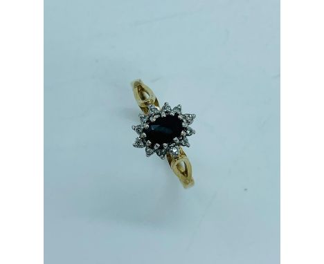 A Sapphire and diamond ring on a 9ct yellow gold setting