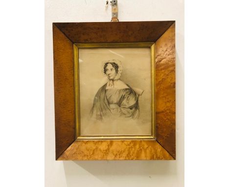 A framed portrait in pencil of Harriet Bevin by T Sampson