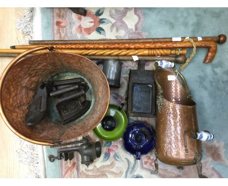 Two copper coal scuttles, a rail lamp, assorted metalware & four wooden walking sticks