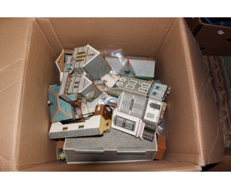 One box of OO/HO scale model railway buildings and a box of rolling stock spares 