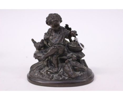 A 19th century bronze figurative group of a boy feeding chickens, possibly French, unsigned