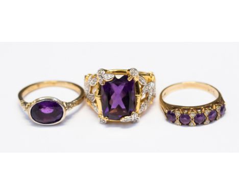 A 9ct ring and amethyst ring, set with an oval cut amethyst, size O1/2, together with a 9ct and amethyst five stone ring set 