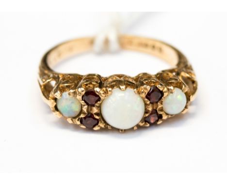 An opal and garnet ring set with three graduated opals with small garnets set in between, in 9ct gold, size M, with a total g