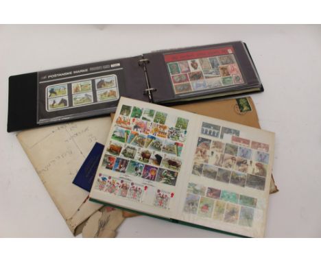 A quantity of mint GB stamps and stamp packs, general albums and coins with GB banknotes