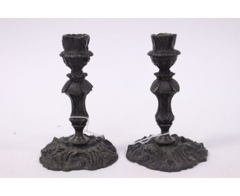 A pair of 19th Century bronze candlesticks with Rococo style decoration (2) 