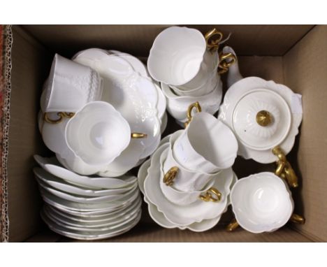 An Aynsley part tea service late 19th early 20th Century white embossed pattern with gilding to handles 10 cups, 17 plates, t