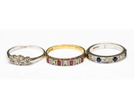 Three gold rings, comprising two 18ct half eternity rings one set with ruby and diamonds, size Q,  the other in 18ct white go