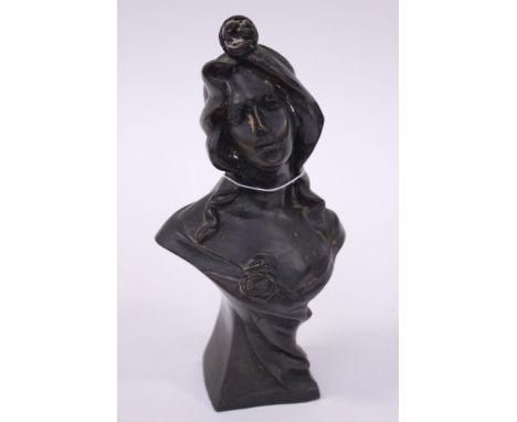 A bronze bust of a 19th century continental lady with a rose in her hair, signed to base, but not legible, verso No 2