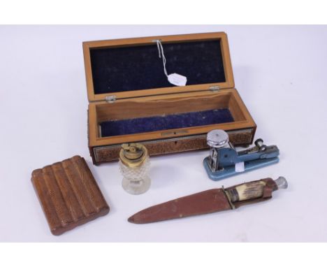 An Anglo Indian glove box (af) a reptile skin cigar pouch, a Scouts knife, a table lighter and a stapler 