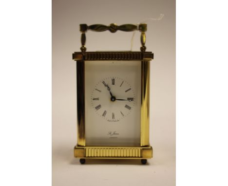 A 20th Century St James London carriage clock and key