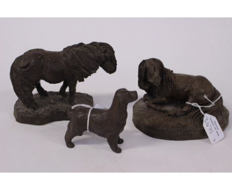 A bronze/resin figure of Shetland Pony possibly by Heredities, together with a resin/bronzed cocker spaniel figure (3), toget