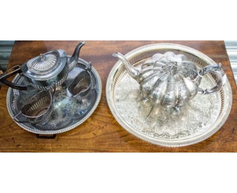 A Victorian Britannia metal melon shaped tea pot circa 1860, (finial inside), together with an Edwardian three piece teas ser