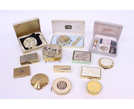 A Kigu boxed compact set, Stratton boxed sets (2), musical compacts (4), No 7 lipstick case holder and Hovbigant Paris, loose