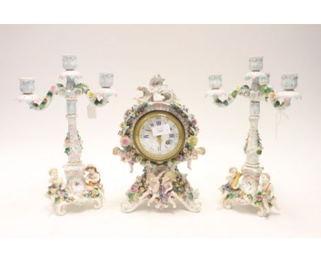 ****Ex Luddington Manor****A pair of German Stitzendorf hard paste floral and figure encrusted three branch candelabra, 36 cm