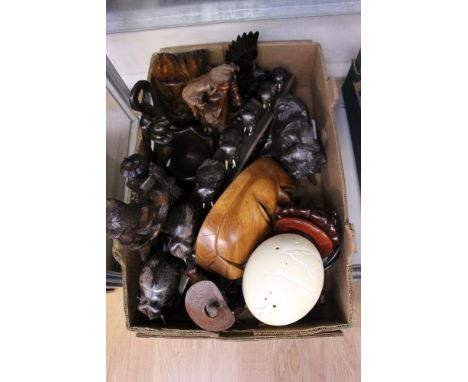 Assorted Eastern carvings some signed Gladmore Reza,and some ceramics including studio Pendelfin and an Ostrich egg light (on