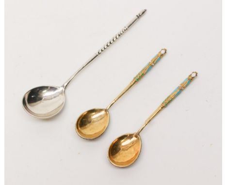  A pair of Russian gilt metal and cloisonne enamel teaspoons together with another Russian silver teaspoon, twisted stem plai