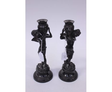 ****Ex Luddington Manor****Pair of 19th Century bronze figural candlesticks, raised on circular socles, 26 cm approx 