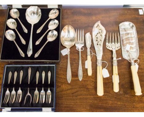 A set of Victorian style silver-plate fish servers, the tines and blade engraved with foliage, bone handles; a crumb scoop an