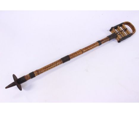A vintage bamboo and brass shooting stick