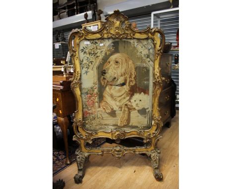 ****Ex Luddington Manor****A 19th Century giltwood firescreen in the Rococo style, depicting Labrador and a puppy 