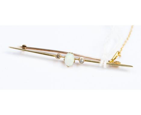  A yellow metal opal and diamond tie pin, 14-15ct probably, set with an oval opal to the centre with a diamond either side, l