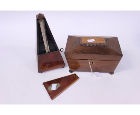 A Mertonome 'Maelzel- Suisse' together with a sarcophagus shaped tea caddy a/f (2)