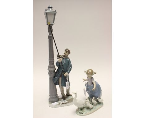 Two Lladro figures, lamp lighter and girl with geese 