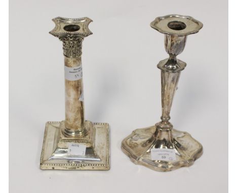 A filled Corinthian column candlestick, Sheffield 1910, approx gross weight 25.1ozt/750.8g, together with another filled cand