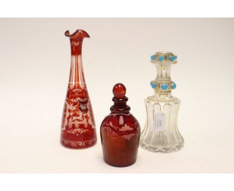 An early 19th century decanter, bludgeon shaped with cerulean blue glass jewelled  stud decoration, a ruby coloured glass dec