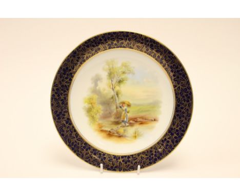  A Royal Worcester porcelain plate painted figure of girl carrying corn sheaves in landscape, within dark blue border with gi