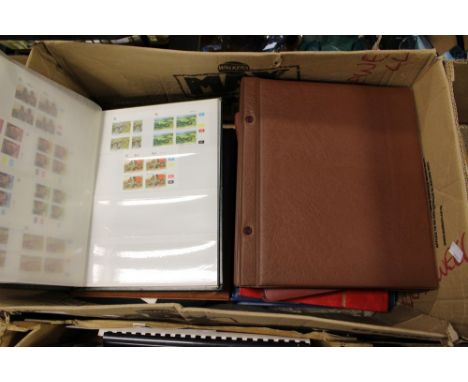 Nine stamp albums including first day covers, GB mint, RSA mint, African FDCs, etc.