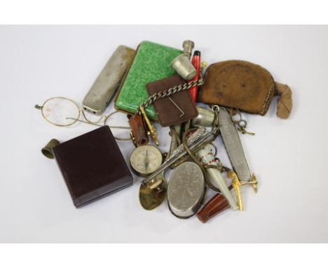 Compass, glass cheroot holder, propelling pencils, cigarette case, pill box, Harrison Line pen knife, specacles, cuff links, 