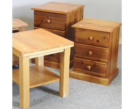 A light oak occasional table, 50cm, together with two pine bedside cabinets