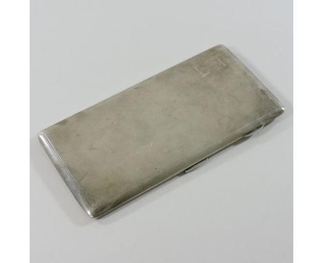 A large early 20th century silver cigarette case, with engine turned decoration, 18cm wide