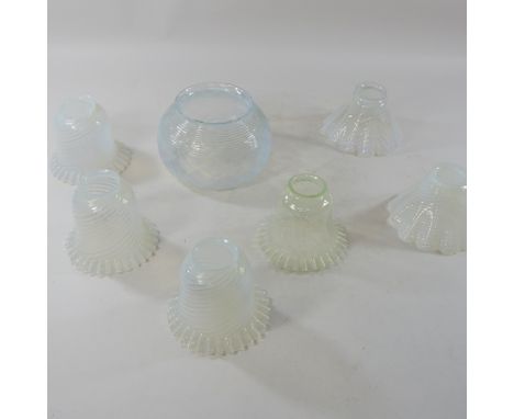 Seven modern vaseline glass lamp shades, largest 20cm diameter