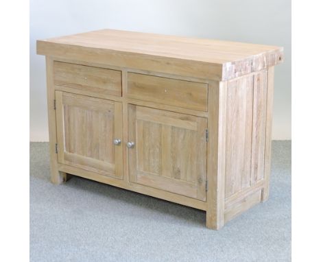 A light oak kitchen island, with drawers below, 134cm