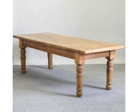 A light elm dining table of large proportions, 243 x 91cm