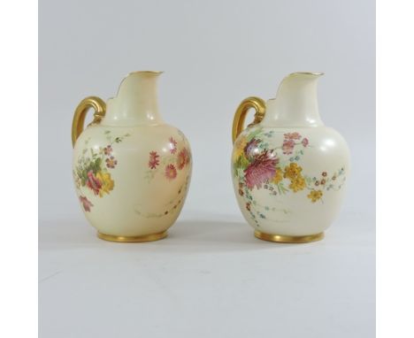 A pair of Royal Worcester blush ivory jugs, 19cm high
