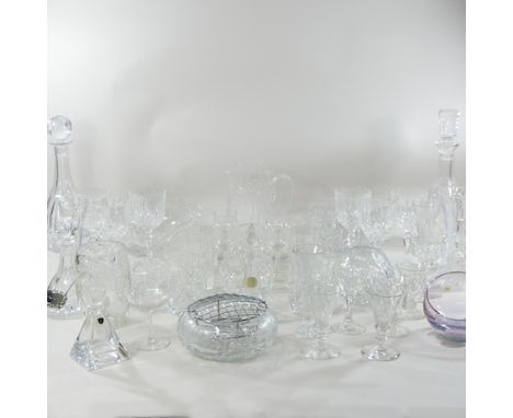 A shelf of cut glass, to include decanters and drinking glasses