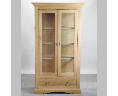 A modern light oak glazed display cabinet, 107cm