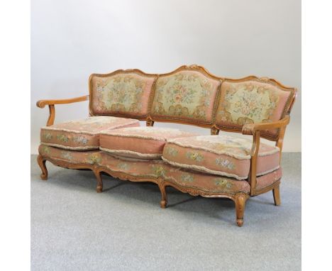 A carved walnut and tapestry upholstered show frame sofa, 180cm