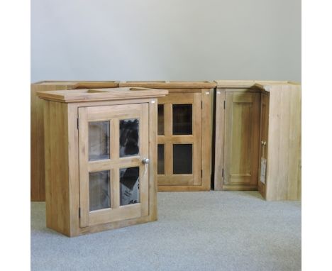 A pair of light oak kitchen cupboards, together with a pair of glazed hanging cabinets, 77cm