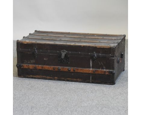 An early 20th century wooden bound trunk, 84cm