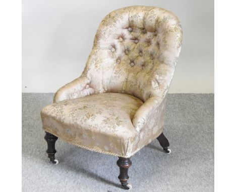 A Victorian brown button back nursing chair